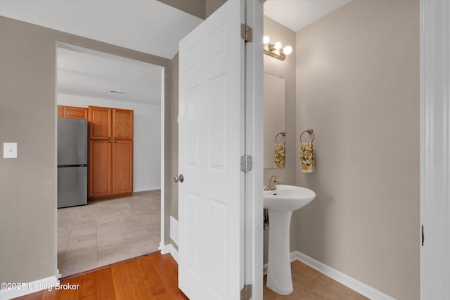 204 Greenleaf Dr, Elizabethtown, KY 42701 - bathroom featuring baseboards, tile patterned floors, and a sink