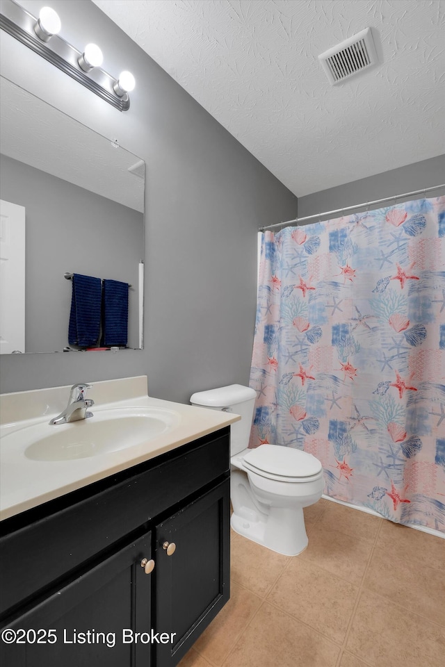 204 Greenleaf Dr, Elizabethtown, KY 42701 - bathroom with vanity, toilet, tile patterned flooring, a textured ceiling, and curtained shower