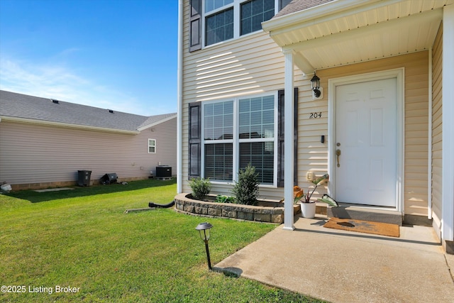 204 Greenleaf Dr, Elizabethtown, KY 42701 - view of exterior entry with central AC unit and a yard