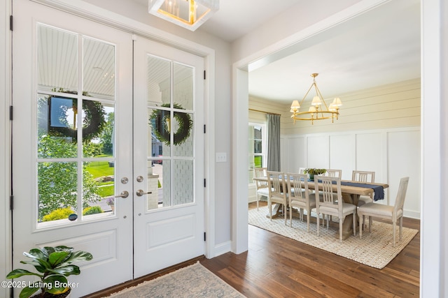 17716 Shakes Creek Dr, Fisherville, KY 40023 - entryway with a chandelier, dark wood-type flooring, french doors, and a decorative wall
