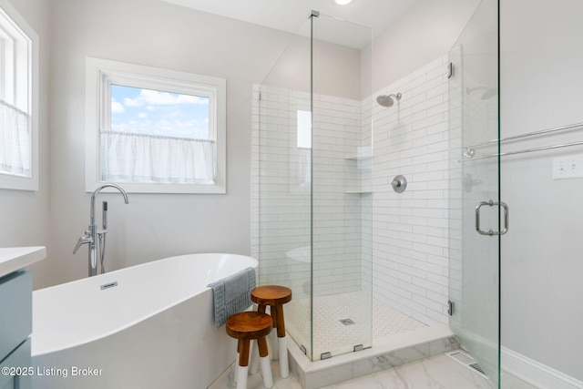 17716 Shakes Creek Dr, Fisherville, KY 40023 - bathroom featuring a shower stall, a soaking tub, vanity, baseboards, and marble look tiles