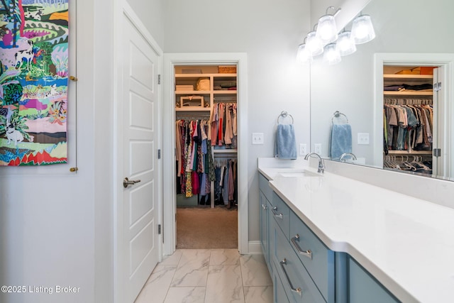 17716 Shakes Creek Dr, Fisherville, KY 40023 - full bath featuring vanity, a walk in closet, marble finish flooring, and baseboards