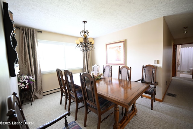 1025 Lake Rd, Campbellsburg, KY 40011 - dining area with a chandelier, light carpet, baseboard heating, baseboards, and a textured ceiling