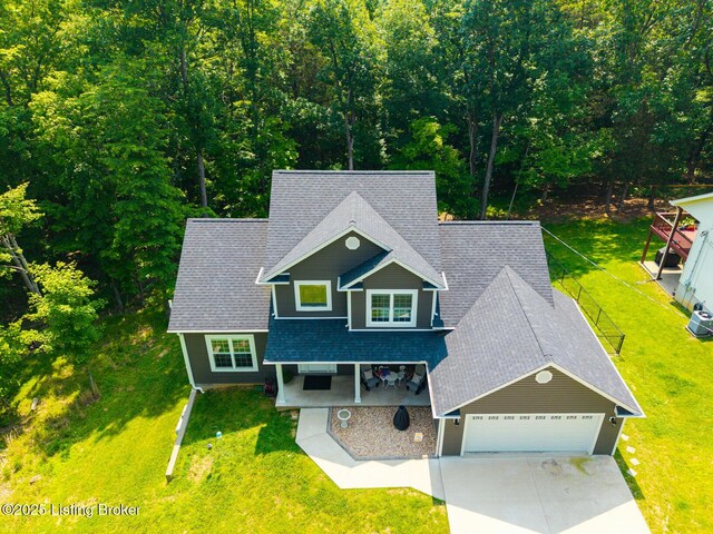 162 Penny Royal Ln, Brandenburg, KY 40108 - view of front of home featuring driveway, a shingled roof, a front lawn, and an attached garage