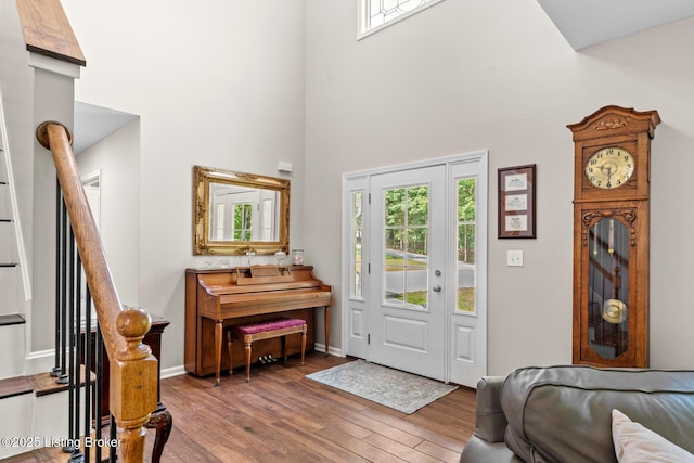 162 Penny Royal Ln, Brandenburg, KY 40108 - foyer with a towering ceiling, wood finished floors, stairs, and baseboards