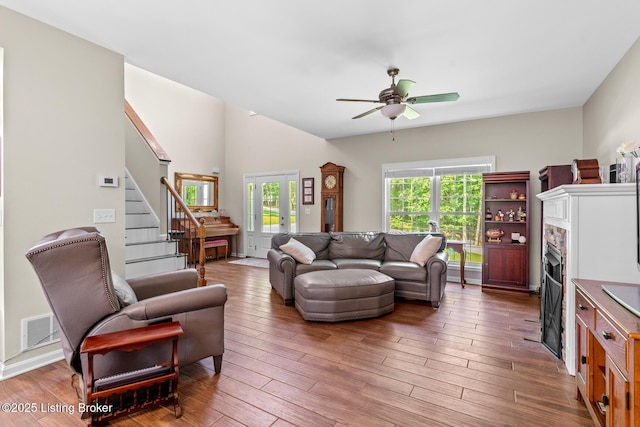 162 Penny Royal Ln, Brandenburg, KY 40108 - living area featuring stairs, ceiling fan, wood finished floors, and a fireplace