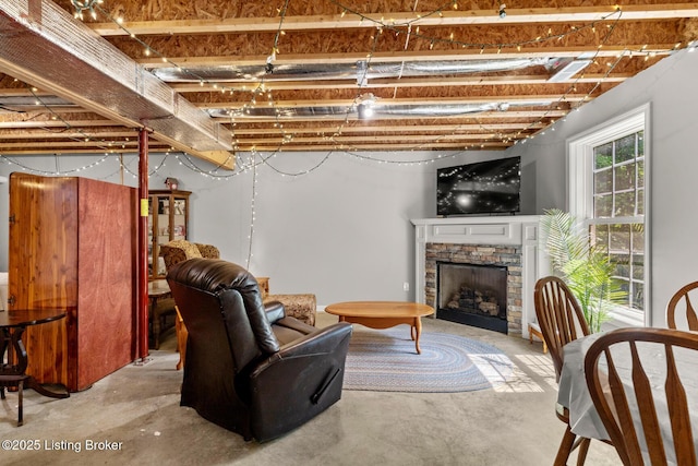 162 Penny Royal Ln, Brandenburg, KY 40108 - living room featuring unfinished concrete flooring and a stone fireplace