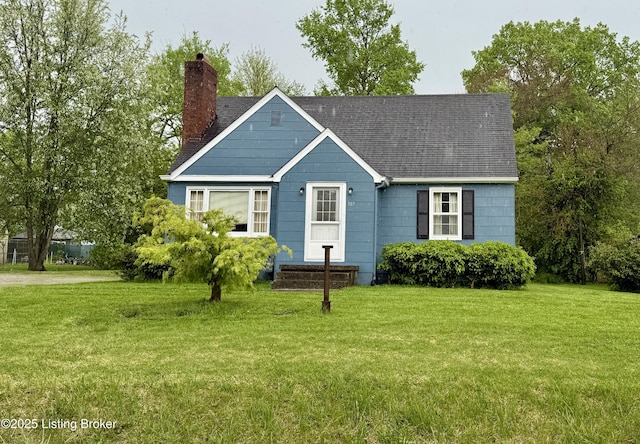 307 E Jefferson St, La Grange, KY 40031 - view of front facade featuring a chimney, a shingled roof, and a front yard