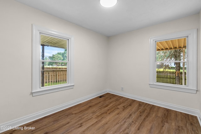 4725 Kiefer Rd, Louisville, KY 40216 - unfurnished room with baseboards and wood finished floors