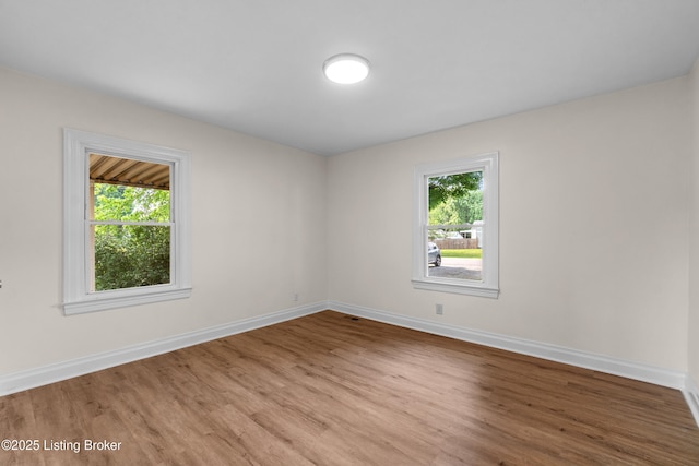 4725 Kiefer Rd, Louisville, KY 40216 - empty room featuring wood finished floors and baseboards
