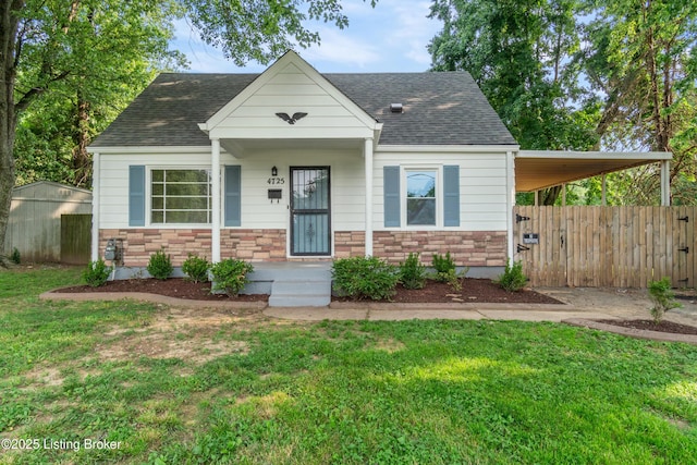 4725 Kiefer Rd, Louisville, KY 40216 - view of front facade featuring stone siding and roof with shingles