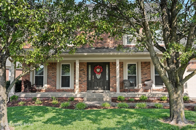 6400 Cedar Branch Ct, Louisville, KY 40291 - view of front facade with brick siding, a porch, and a front lawn