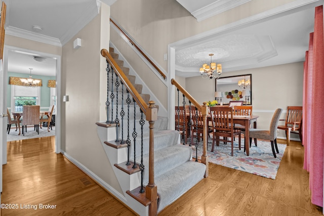 6400 Cedar Branch Ct, Louisville, KY 40291 - stairs featuring a chandelier, wood finished floors, and ornamental molding