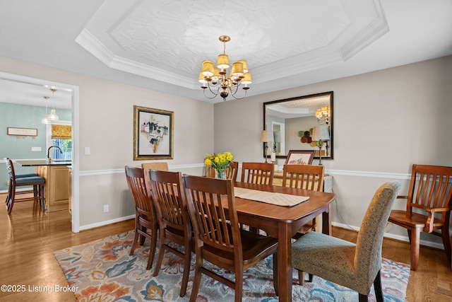 6400 Cedar Branch Ct, Louisville, KY 40291 - dining area featuring a raised ceiling, a chandelier, wood finished floors, and ornamental molding