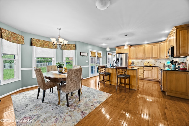 6400 Cedar Branch Ct, Louisville, KY 40291 - dining room with a chandelier and light wood-style flooring