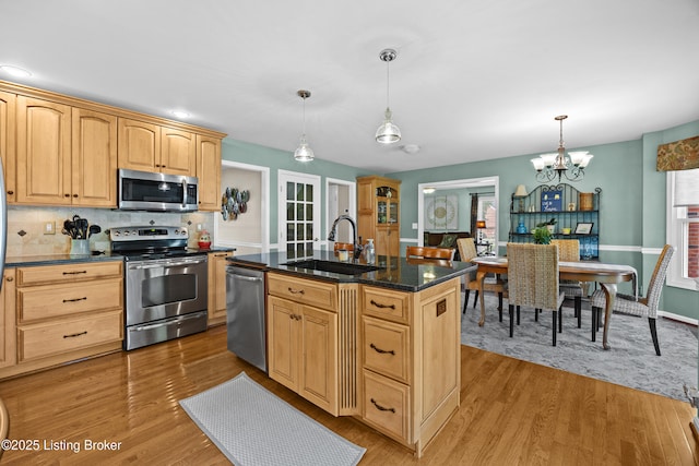 6400 Cedar Branch Ct, Louisville, KY 40291 - kitchen with appliances with stainless steel finishes, a chandelier, light wood-style floors, and hanging light fixtures