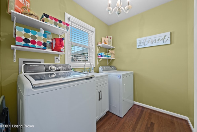 6400 Cedar Branch Ct, Louisville, KY 40291 - laundry room with washing machine and clothes dryer, dark wood-style flooring, a chandelier, and cabinet space
