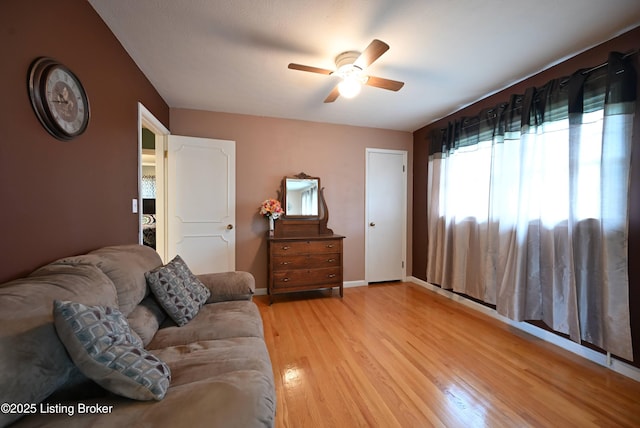 4913 D Lue Ct, Louisville, KY 40216 - living area with a ceiling fan, light wood-type flooring, and baseboards