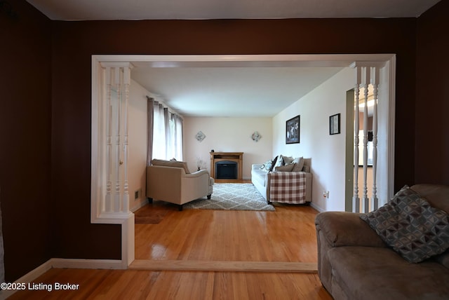 4913 D Lue Ct, Louisville, KY 40216 - living room with wood finished floors, baseboards, and a fireplace