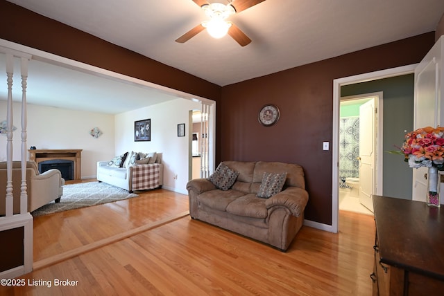 4913 D Lue Ct, Louisville, KY 40216 - living area with light wood-type flooring, ceiling fan, and baseboards
