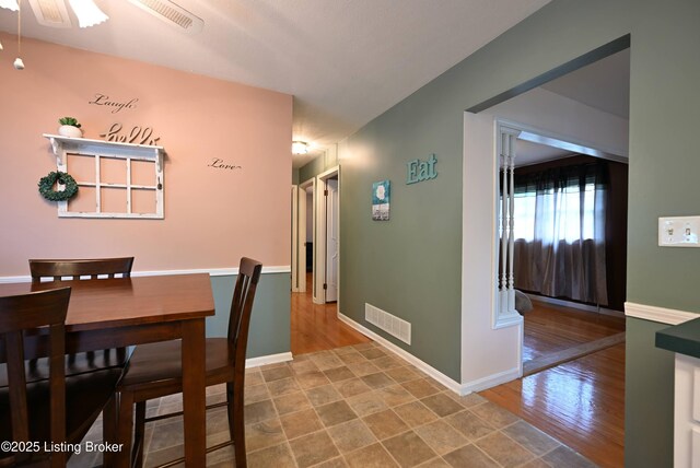 4913 D Lue Ct, Louisville, KY 40216 - dining space with wood finished floors, baseboards, and ceiling fan