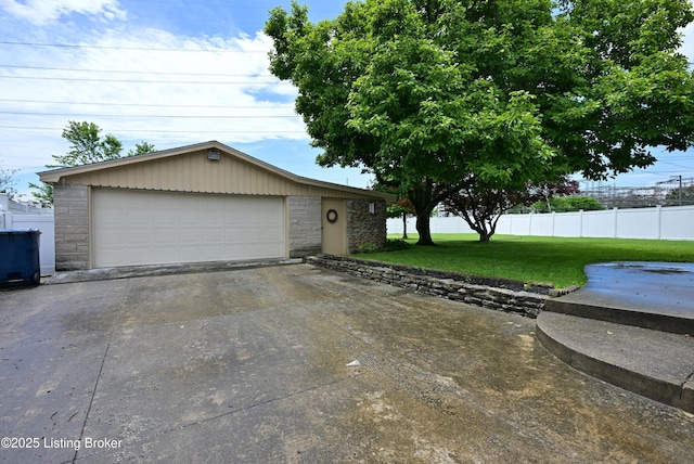 4913 D Lue Ct, Louisville, KY 40216 - view of front of home featuring stone siding, a garage, and an outdoor structure