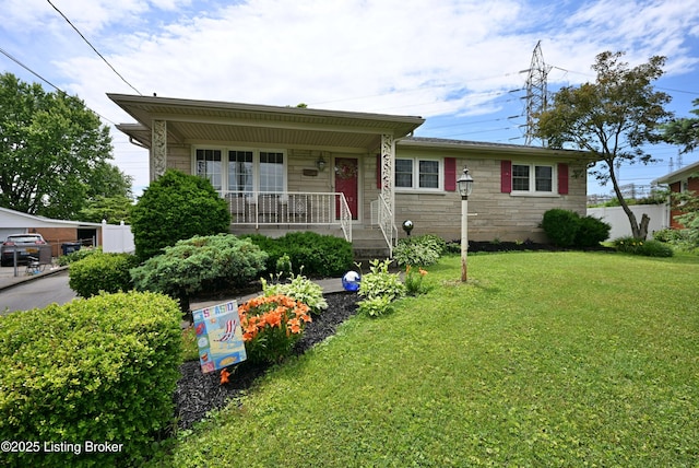 4913 D Lue Ct, Louisville, KY 40216 - view of front facade with a front lawn, stone siding, and a porch