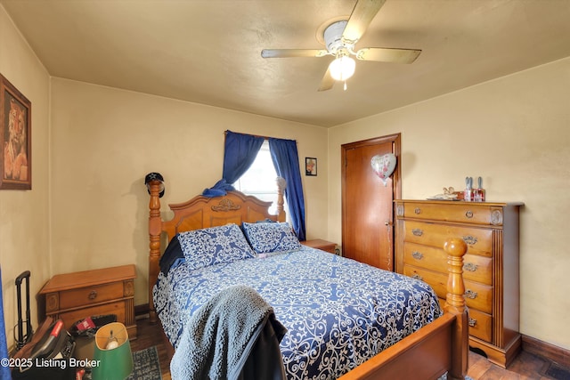 315 N 27th St, Louisville, KY 40212 - bedroom featuring baseboards, ceiling fan, and wood finished floors