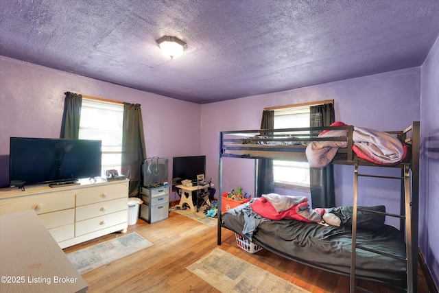 315 N 27th St, Louisville, KY 40212 - bedroom featuring light wood finished floors and a textured ceiling