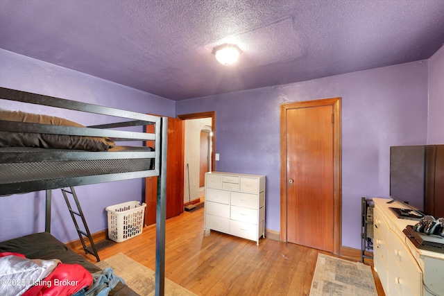 315 N 27th St, Louisville, KY 40212 - bedroom featuring wood finished floors and a textured ceiling