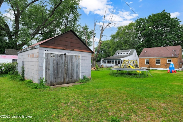 315 N 27th St, Louisville, KY 40212 - view of grassy yard with a trampoline