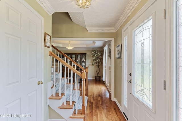 348 Old Stone Dr, Simpsonville, KY 40067 - entrance foyer with stairs, wood finished floors, baseboards, ornamental molding, and a textured ceiling