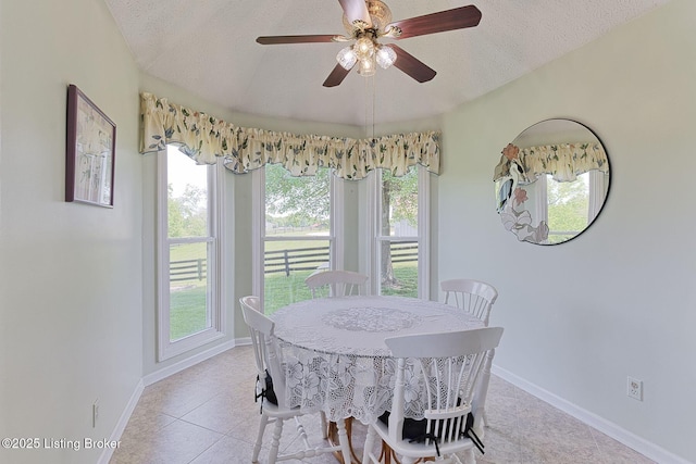 348 Old Stone Dr, Simpsonville, KY 40067 - dining room featuring a textured ceiling, baseboards, a ceiling fan, and light tile patterned floors