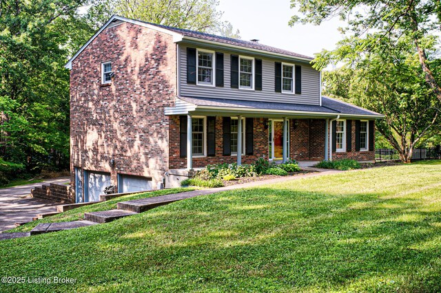 3325 Chenoweth Run Rd, Louisville, KY 40299 - view of front of property with an attached garage, brick siding, a front lawn, a porch, and driveway