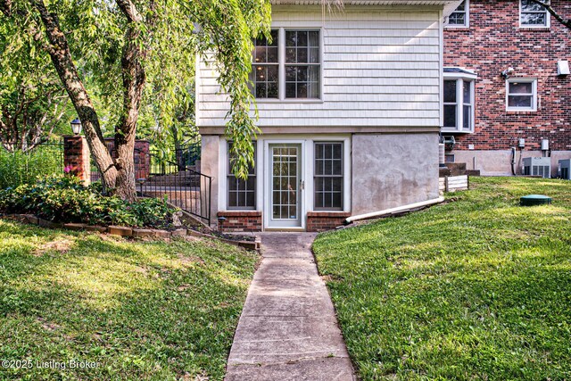 3325 Chenoweth Run Rd, Louisville, KY 40299 - rear view of property with a yard and brick siding