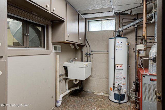 3325 Chenoweth Run Rd, Louisville, KY 40299 - utility room with gas water heater and a sink
