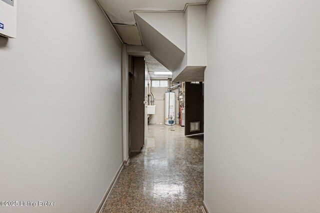 3325 Chenoweth Run Rd, Louisville, KY 40299 - hall featuring water heater, baseboards, and granite tiled floors