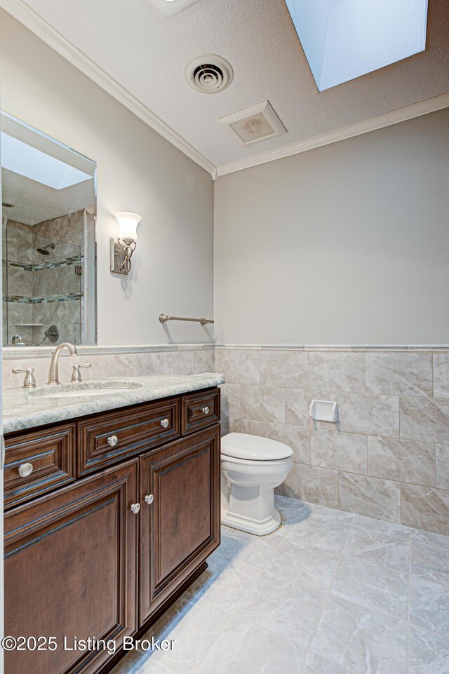 3325 Chenoweth Run Rd, Louisville, KY 40299 - bathroom featuring crown molding, vanity, a stall shower, toilet, and a skylight