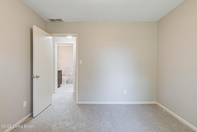 3325 Chenoweth Run Rd, Louisville, KY 40299 - unfurnished room with light colored carpet, a textured ceiling, and baseboards