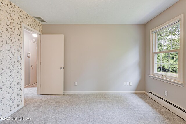 3325 Chenoweth Run Rd, Louisville, KY 40299 - carpeted empty room featuring baseboard heating and baseboards