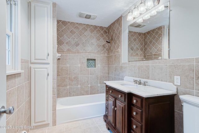 3325 Chenoweth Run Rd, Louisville, KY 40299 - full bathroom with tile walls, vanity, washtub / shower combination, toilet, and tile patterned flooring