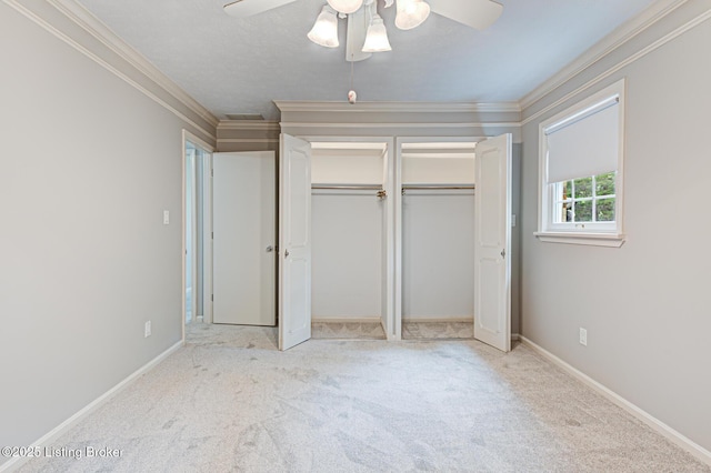 3325 Chenoweth Run Rd, Louisville, KY 40299 - unfurnished bedroom with carpet floors, ornamental molding, a ceiling fan, baseboards, and a closet