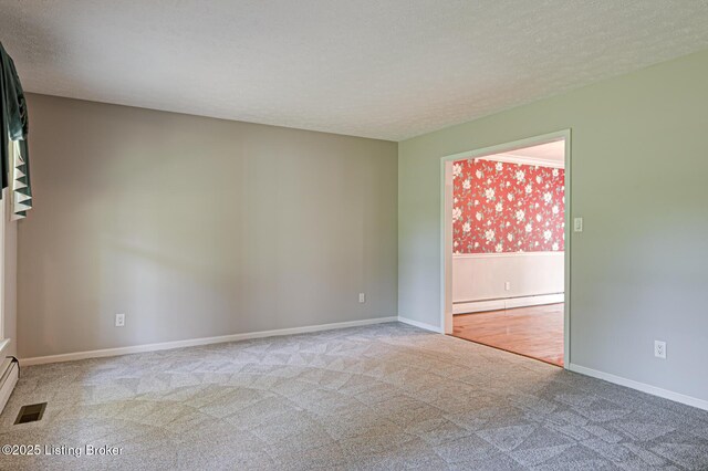 3325 Chenoweth Run Rd, Louisville, KY 40299 - carpeted empty room featuring a baseboard radiator, a textured ceiling, and baseboards