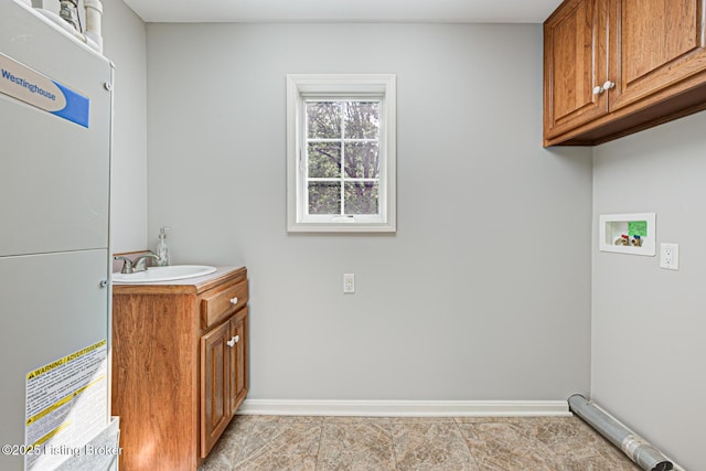 3325 Chenoweth Run Rd, Louisville, KY 40299 - laundry area with cabinet space, baseboards, hookup for a washing machine, and light tile patterned flooring