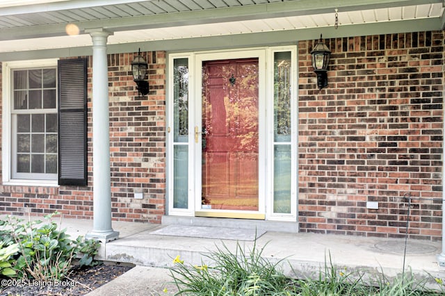 3325 Chenoweth Run Rd, Louisville, KY 40299 - view of exterior entry with brick siding and a porch