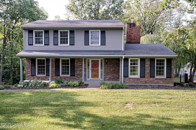 3325 Chenoweth Run Rd, Louisville, KY 40299 - traditional home with a chimney, a front lawn, brick siding, and covered porch