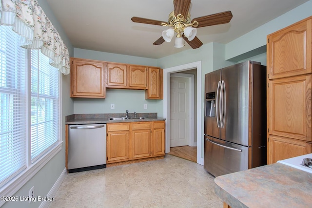 1115 Springview Dr, Louisville, KY 40219 - kitchen featuring appliances with stainless steel finishes, plenty of natural light, a ceiling fan, and light tile patterned flooring