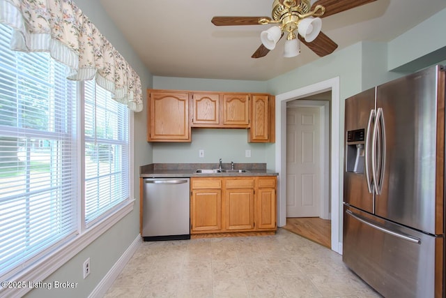 1115 Springview Dr, Louisville, KY 40219 - kitchen with appliances with stainless steel finishes, a ceiling fan, and light tile patterned floors