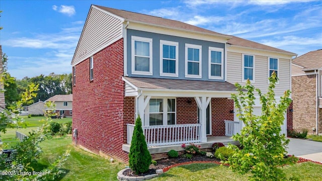11210 Remembrance Ln, Louisville, KY 40229 - view of front facade featuring a porch, brick siding, concrete driveway, and a front yard