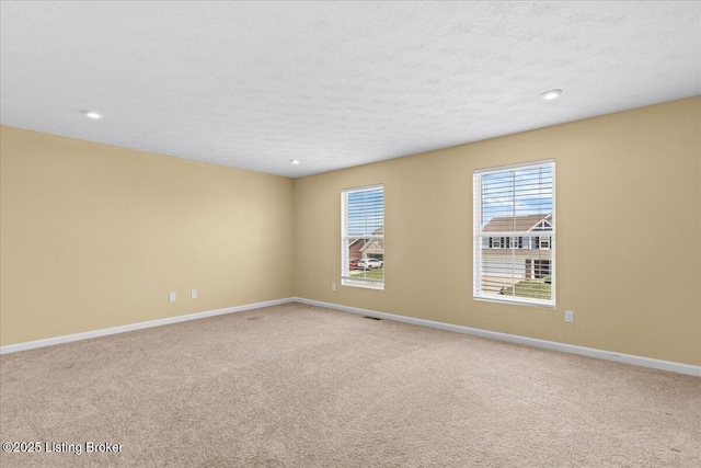 11210 Remembrance Ln, Louisville, KY 40229 - unfurnished room with carpet, a textured ceiling, and recessed lighting